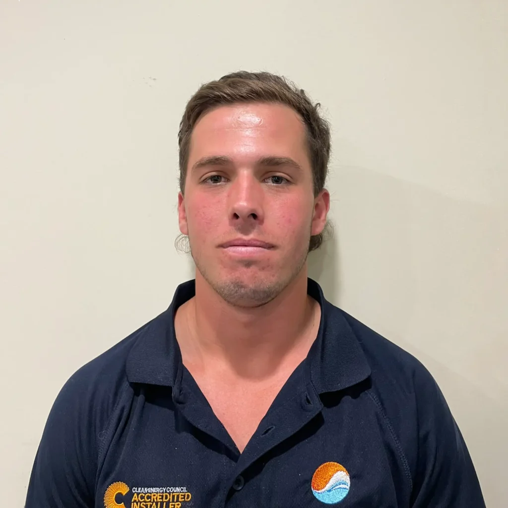 A portrait of a Solar Water Wind employee who is a solar Electrician